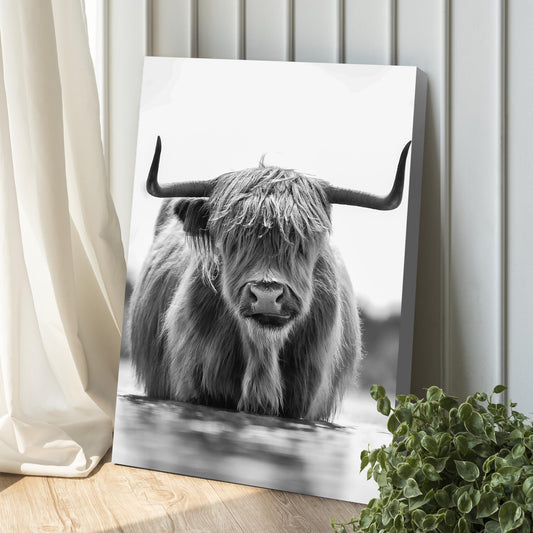 Grayscale Highland Cow portrait canvas wall art leaning against a paneled wall on Tampa Home & Garden Store