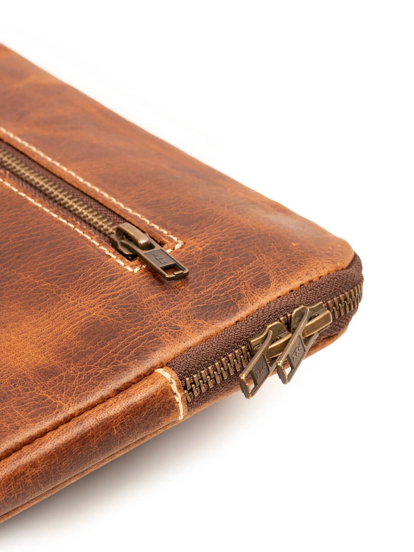 Tan leather laptop sleeve with secure YKK zipper closure on Tampa Home & Garden Store
