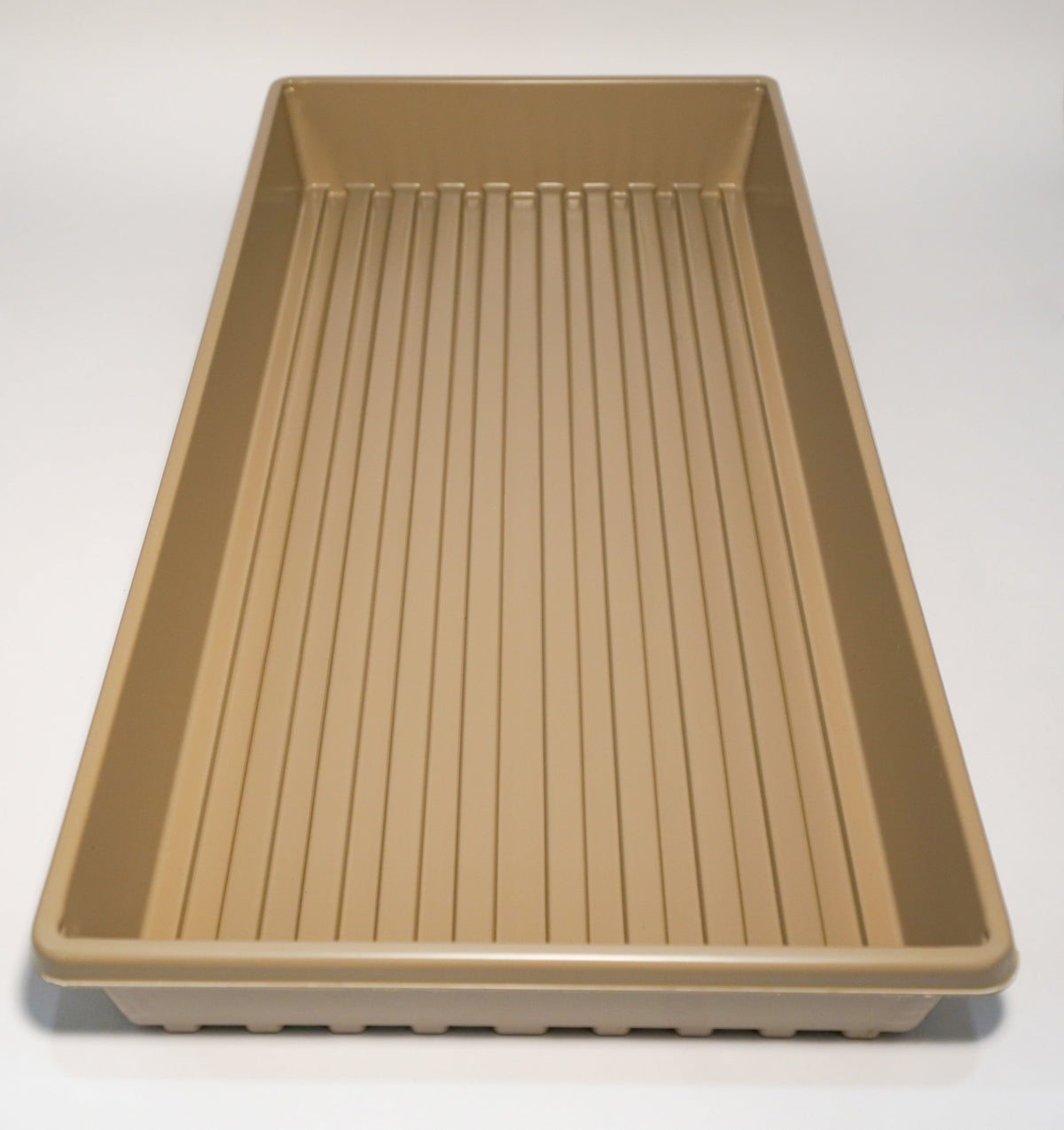 Heavy-Duty growing tray in tan plastic with ribbed base and no drain holes on Tampa Home & Garden Store