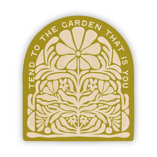 Tend to the Garden That Is You vinyl sticker round gold badge with beige floral mandala design on Tampa Home & Garden Store