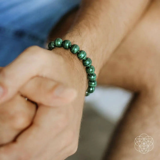 Malachite Anxiety Bracelet with green striped beads on the wrist by Conscious Items on Tampa Home & Garden Store