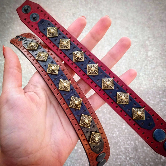Balteus leather bracelet with brass rivet studs on red blue and brown straps three-strand design on Tampa Home & Garden Store