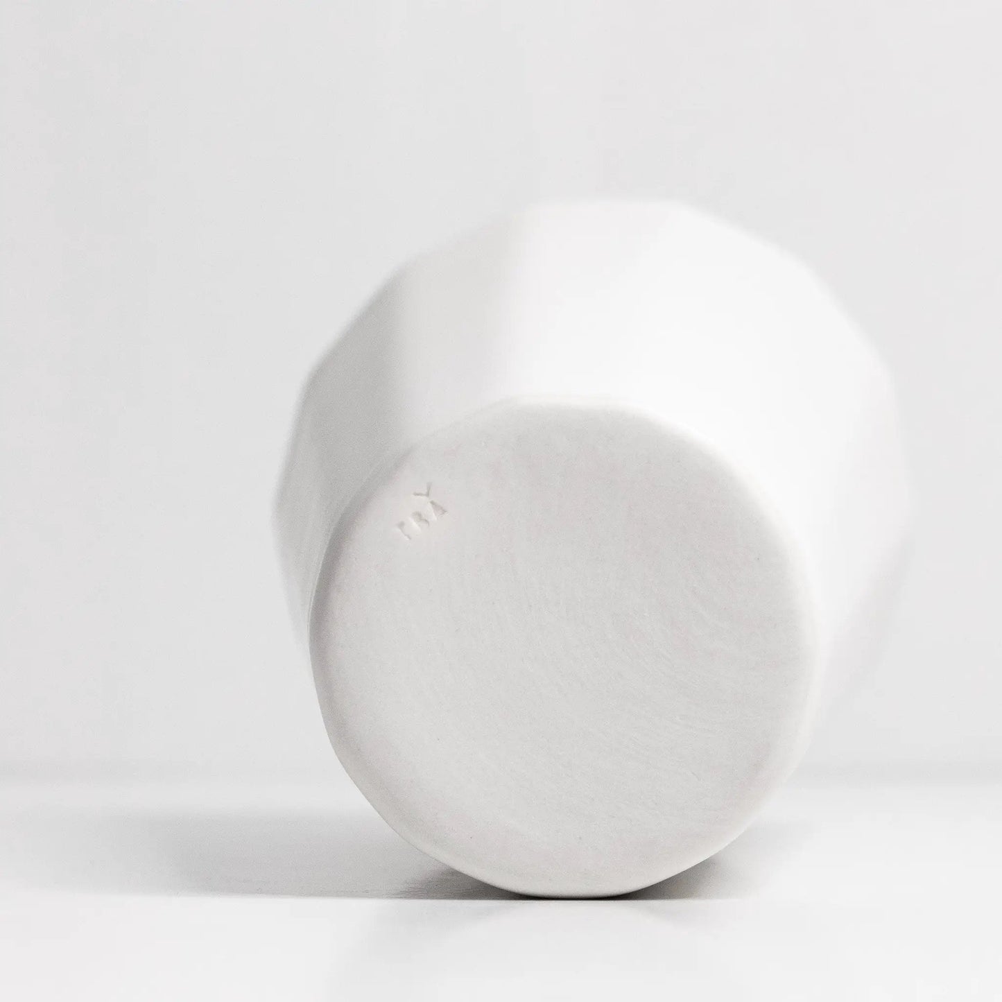 Handmade porcelain pint cup by Ember Collective, white ceramic with embossed logo on base on Tampa Home & Garden Store