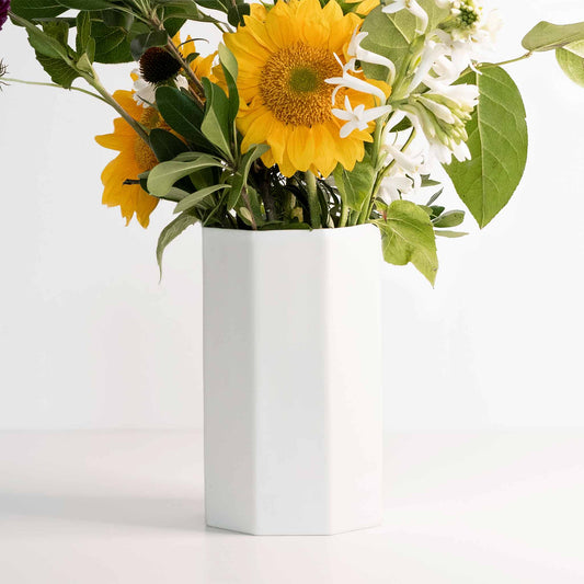 Handmade porcelain bouquet vase Ember Collective with yellow sunflowers and greens on Tampa Home & Garden Store