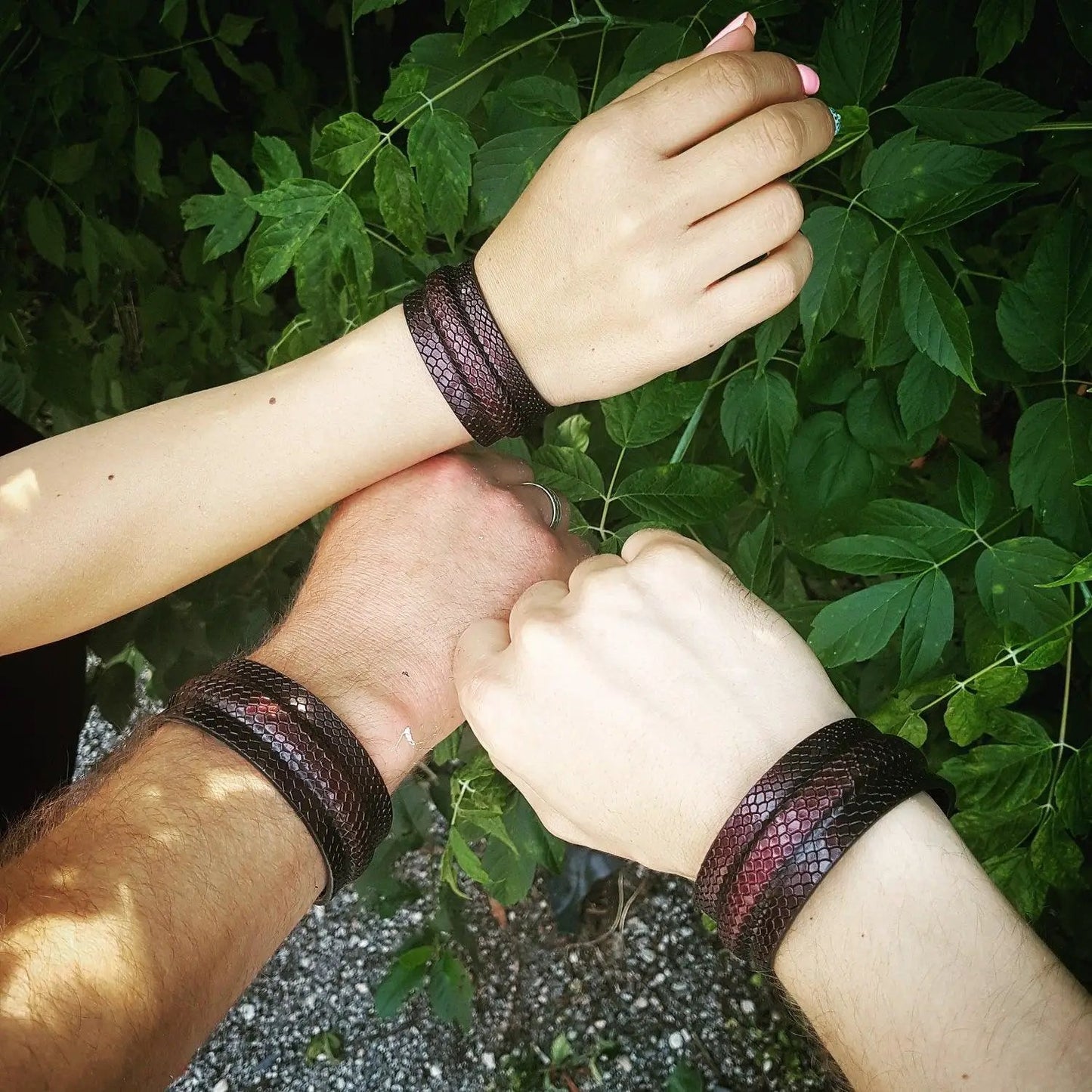 Cobra bracelet with spring button closure in brown snakeskin worn on 3 wrists by Bestia Dog Gear on Tampa Home & Garden Store