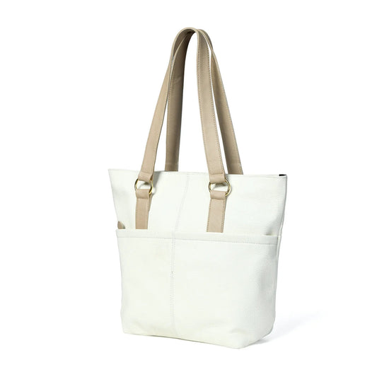 Ivory leather tote bag with gold ring hardware, white body and tan handles on Tampa Home & Garden Store