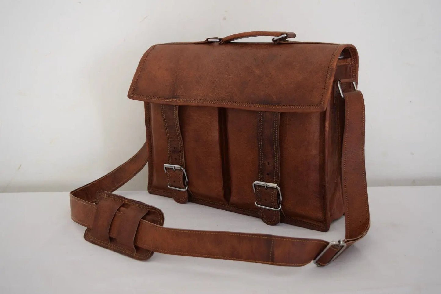 Vintage brown leather lawyer briefcase messenger bag with two buckle straps on Tampa Home & Garden Store
