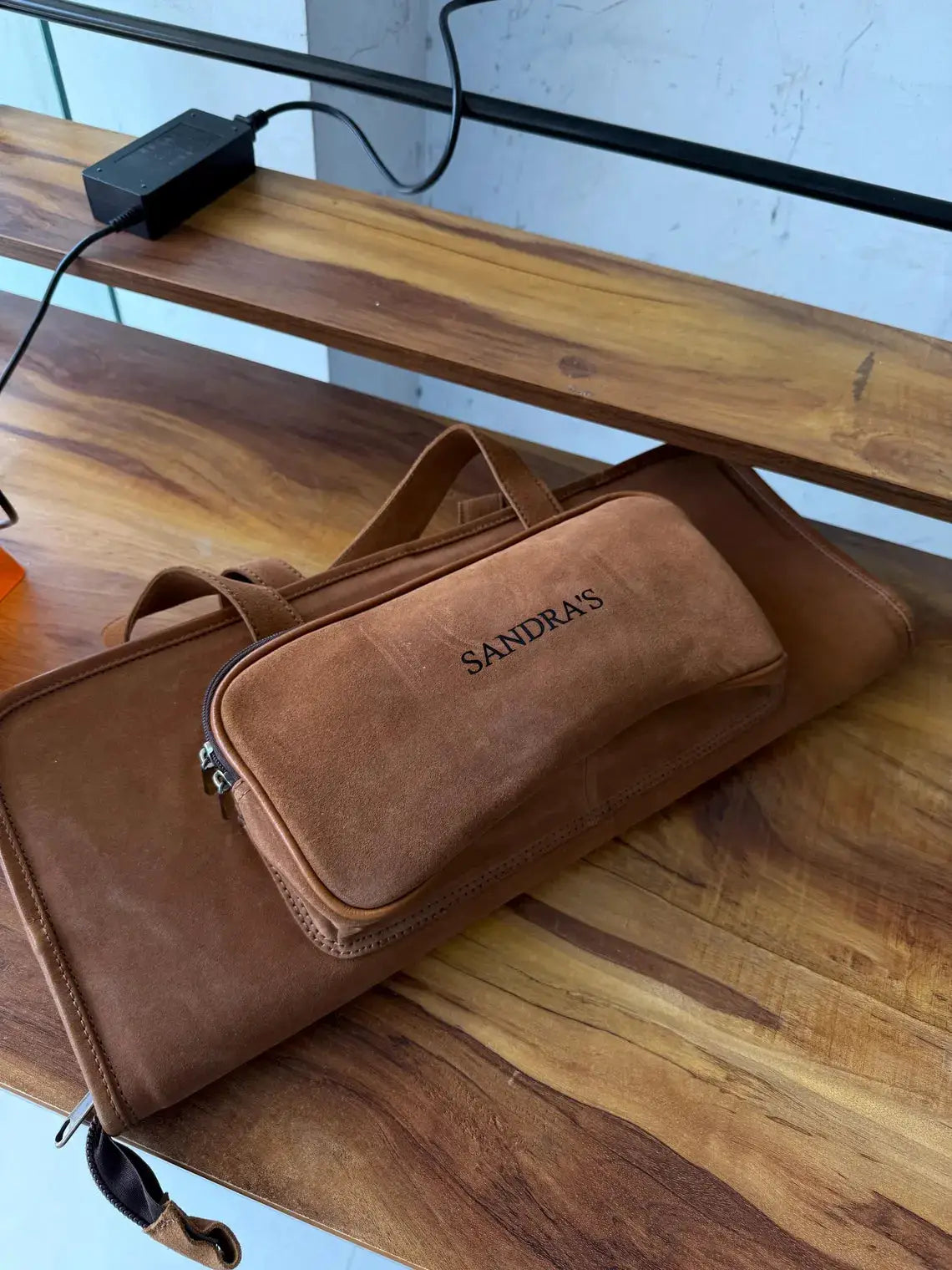 Buffalo leather drumstick case by Sandra's in brown suede with zipped front pocket on Tampa Home & Garden Store