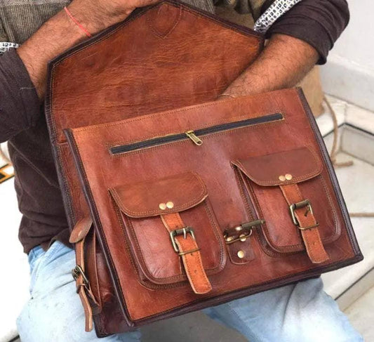 Brown leather messenger bag with multiple pockets, front zip pocket and buckle flaps on Tampa Home & Garden Store