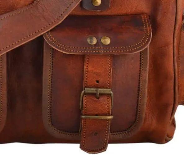 Multitasker crossbody bag in brown goat leather with front buckle pocket on Tampa Home & Garden Store