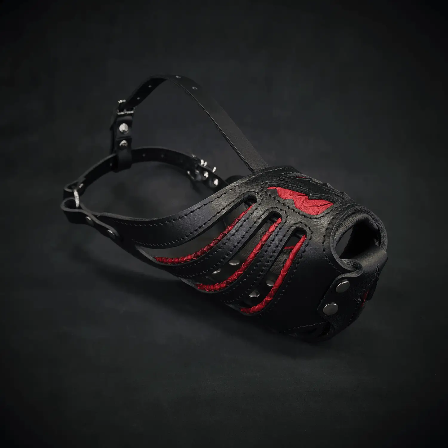Red Dragon basket muzzle for dogs leather black with red panels and metal studs on Tampa Home & Garden Store