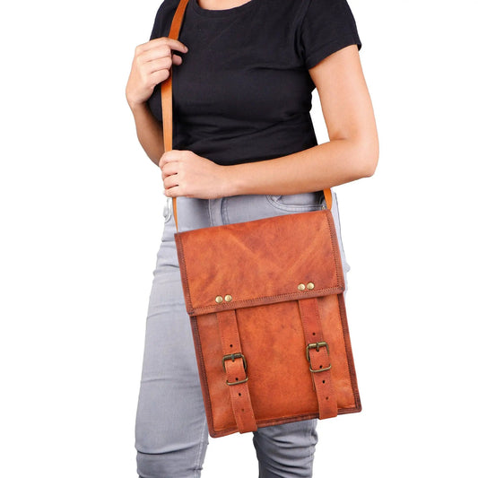 Brown leather crossbody bag with adjustable strap on Tampa Home & Garden Store
