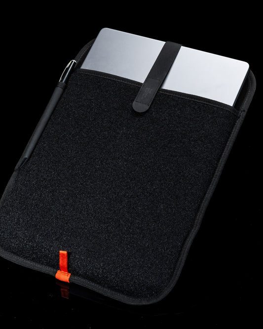 Laptop Sleeve black textured fabric with orange pull tab and strap by The Brown Buffalo on Tampa Home & Garden Store