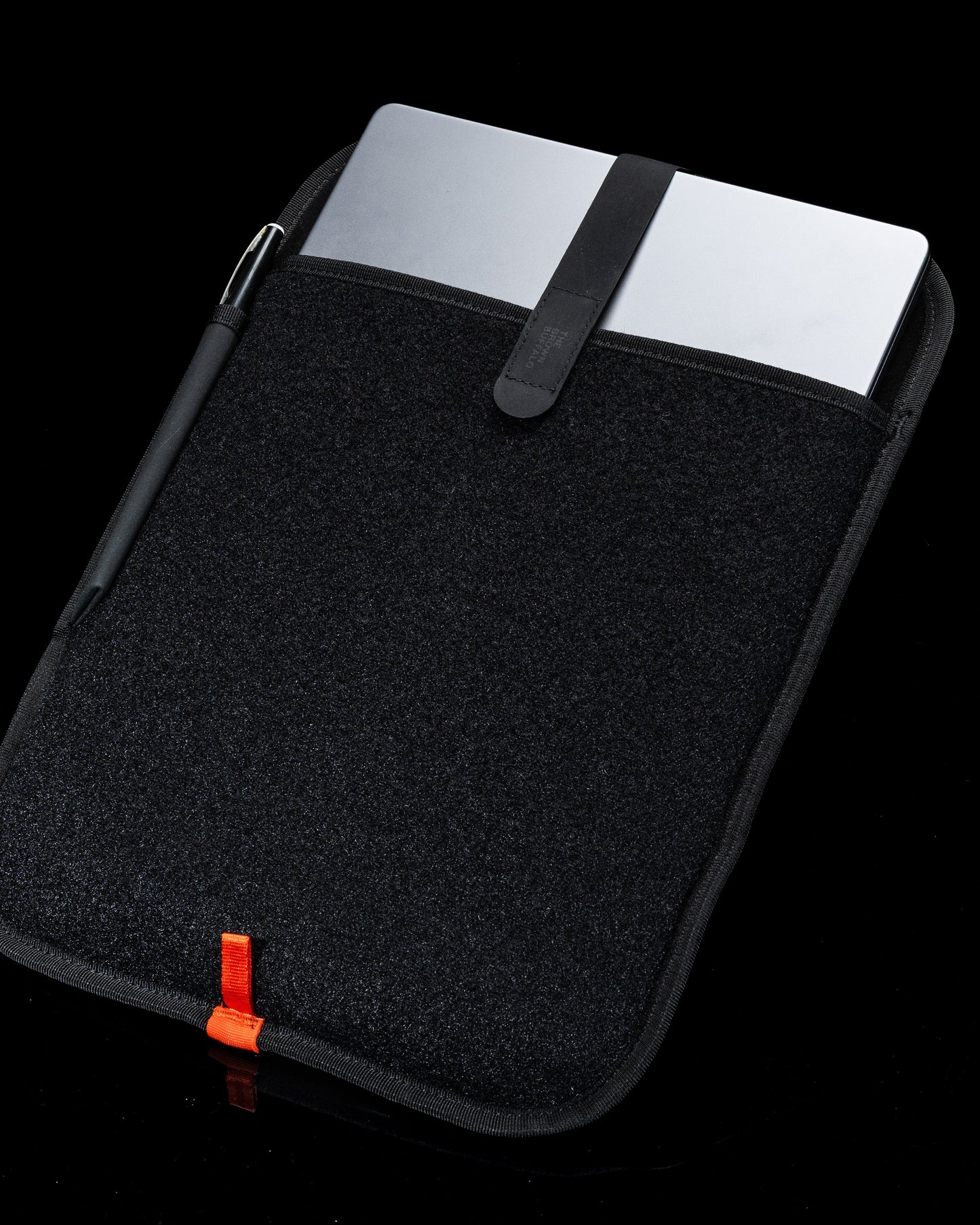 Laptop Sleeve black textured fabric with orange pull tab and strap by The Brown Buffalo on Tampa Home & Garden Store