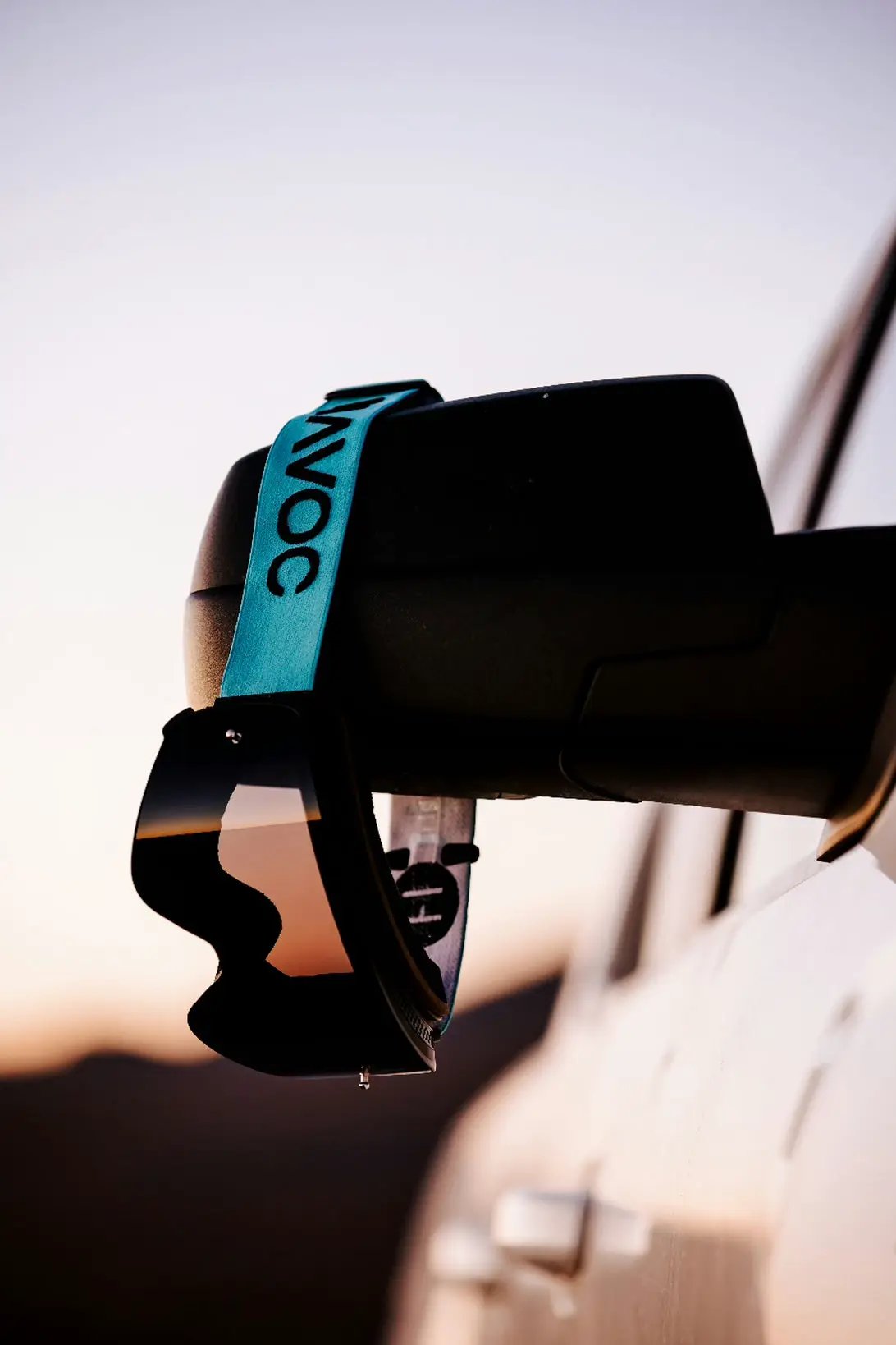 Havoc Infinity Goggle with turquoise HAVOC strap, black frame and amber lens on mounting rail on Tampa Home & Garden Store