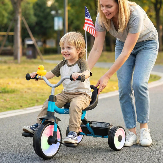 Toddler tricycle with blue frame, glowing wheels and storage basket on Tampa Home & Garden Store