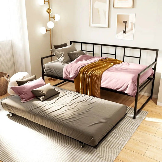 Twin black metal daybed frame with roll-out trundle, grid-style headboard, gray mattress on trundle on Tampa Home & Garden Store