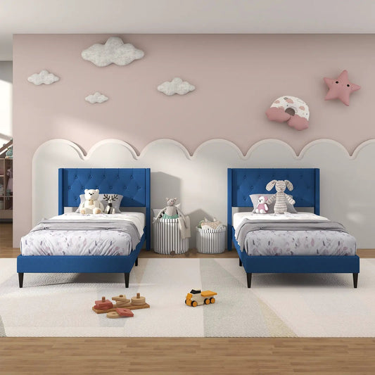 Twin upholstered platform beds with blue tufted wingback headboards in a pink kids room on Tampa Home & Garden Store