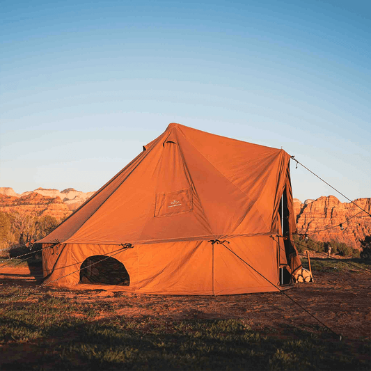 Regatta Bell Tent 20ft Desert Red, used orange canvas pitched in desert landscape with formations on Tampa Home & Garden Store