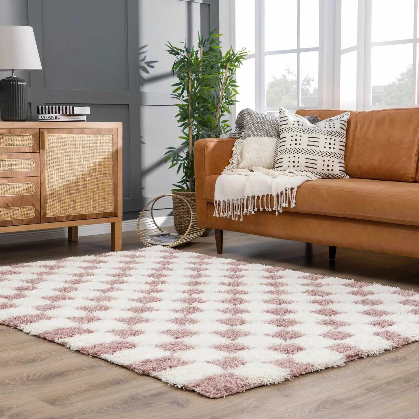 Atira pink checkered shag rug with plush texture in living room setting Boutique Rugs on Tampa Home & Garden Store