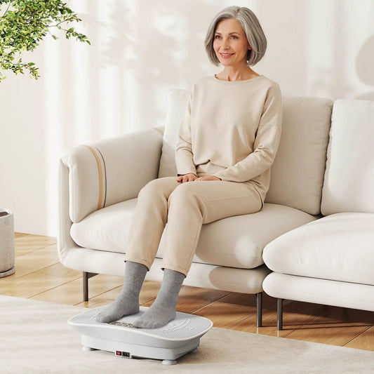 Vibration plate exercise machine with beige-clad woman on gray platform in bright room on Tampa Home & Garden Store
