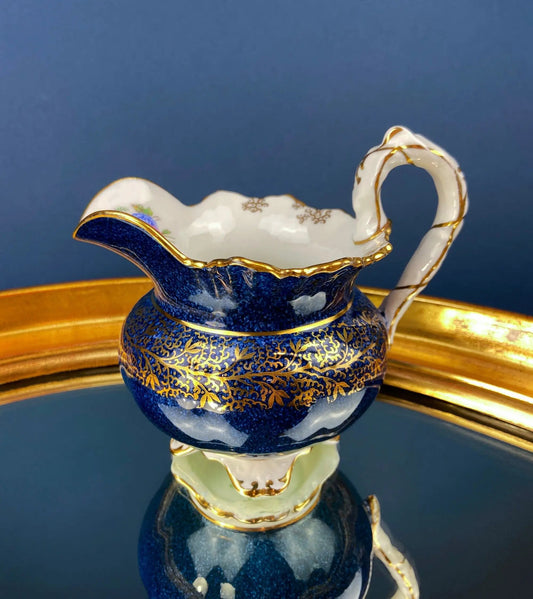 Aynsley blue and gold creamer with white handle, scalloped rim and gilt detailing on Tampa Home & Garden Store