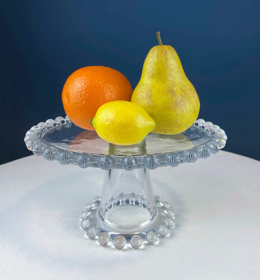 Vintage clear glass cake stand with beaded rim and pedestal on Tampa Home & Garden Store