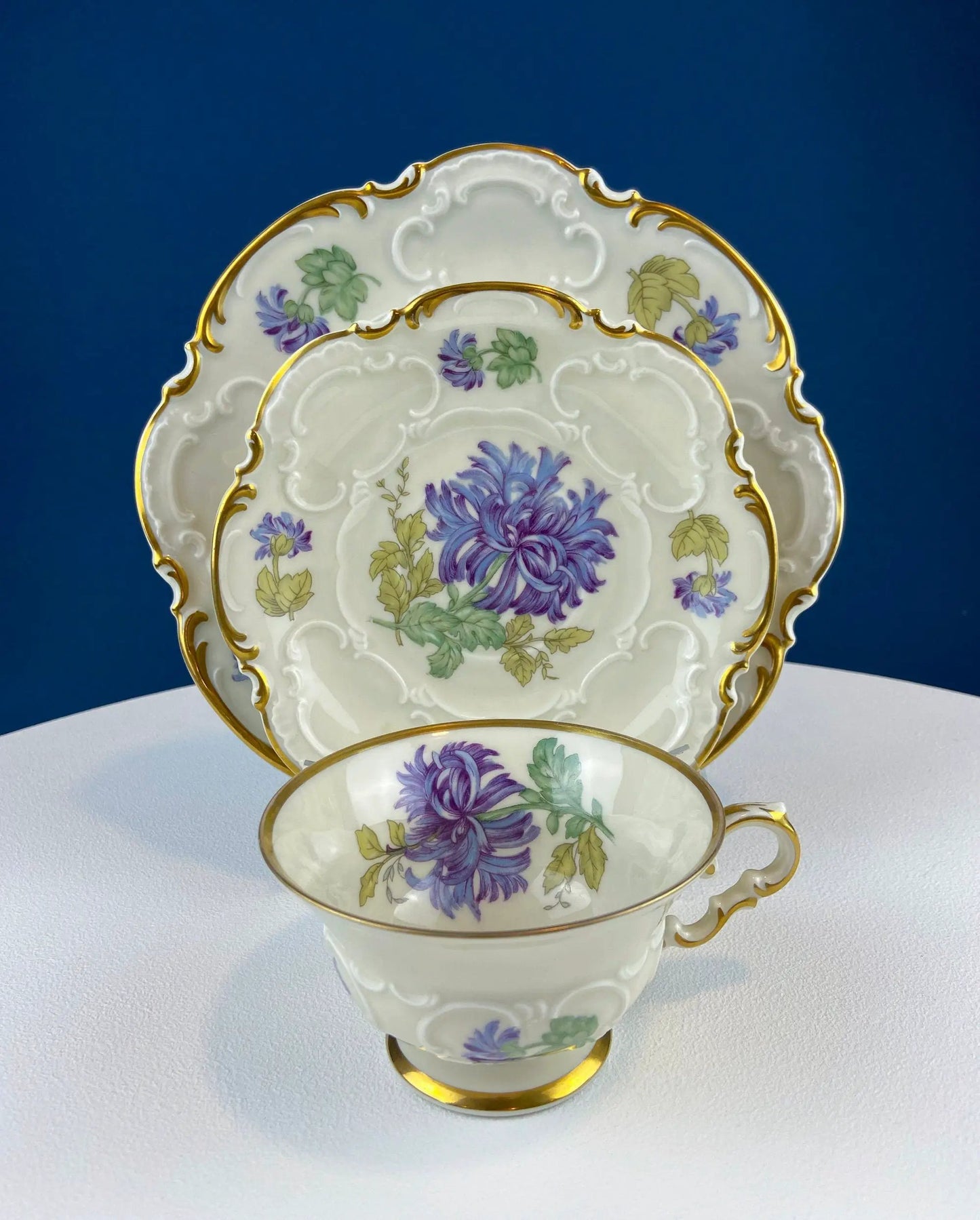 Vintage teacup and saucers set in bone china with purple floral motif and gold trim on Tampa Home & Garden Store