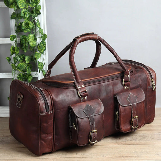 Vintage full-grain leather duffle bag in brown with top handles and exterior pockets on Tampa Home & Garden Store