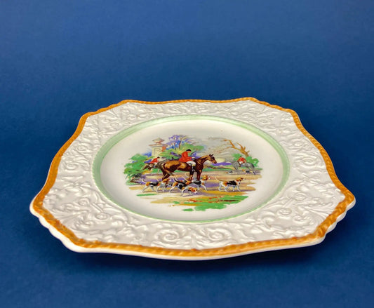 Vintage hunting scene porcelain plate by Royal Winton with orange rim and embossed border on Tampa Home & Garden Store
