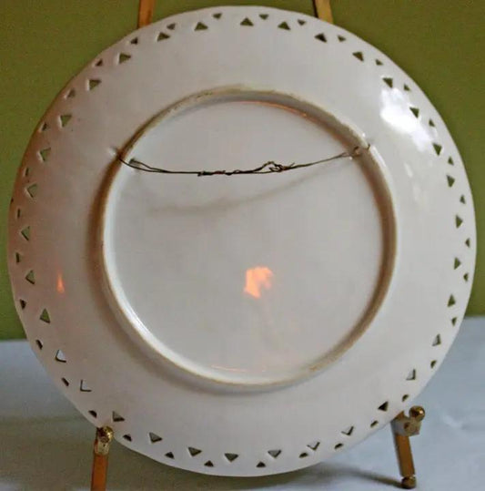 Vintage porcelain decorative plate with lacy scalloped rim, white finish, hanging wire on Tampa Home & Garden Store