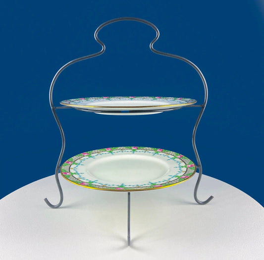 Plate rack vintage two-tier display stand with floral-edged porcelain plates on metal frame on Tampa Home & Garden Store