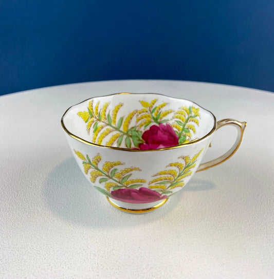 Tea cup from Vintage Roslyn porcelain with yellow floral and pink rose motif, gold rim on Tampa Home & Garden Store