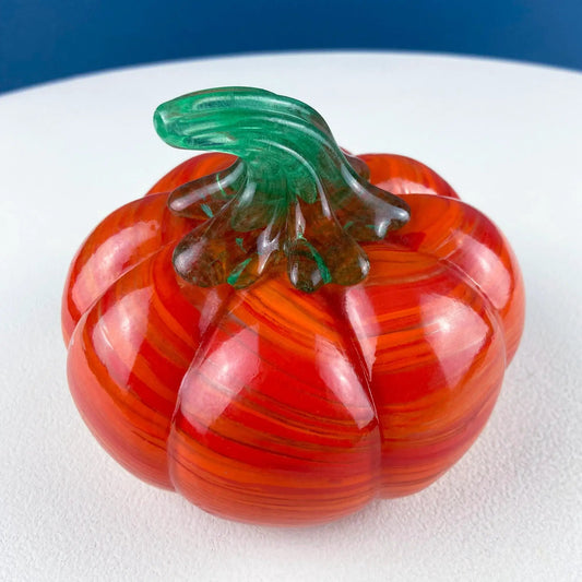Vintage hand-blown orange glass pumpkin with marbled finish and green glass stem on Tampa Home & Garden Store
