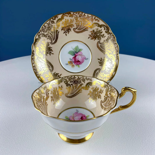 Paragon peach tea cup and saucer set with gold filigree and red rose centerpiece on Tampa Home & Garden Store
