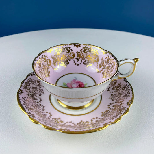 Paragon pink tea cup and saucer with gold filigree and red rose motif on Tampa Home & Garden Store