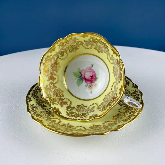 Vintage Paragon yellow tea cup and saucer porcelain with gold filigree and pink rose center on Tampa Home & Garden Store