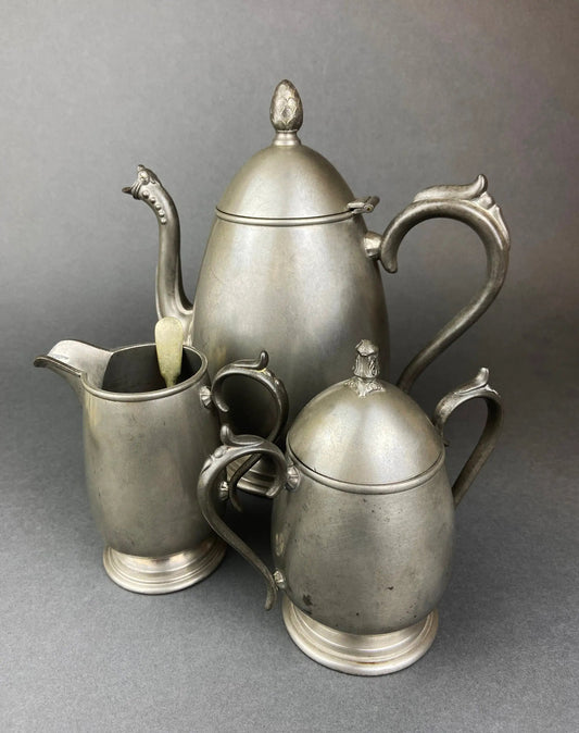 Vintage pewter coffee pot and creamer set with ornate handles; tarnished finish on Tampa Home & Garden Store