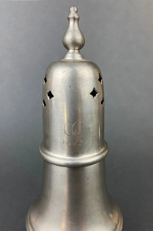 Vintage pewter sugar and cinnamon shaker with diamond perforations and a 1976 engraving on Tampa Home & Garden Store