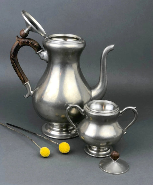Vintage pewter tea pot with lid and matching sugar bowl set, wooden-handled spout and lid on Tampa Home & Garden Store