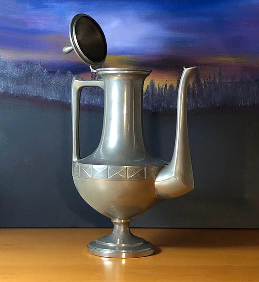 Vintage pewter teapot with rustic banded base, open lid and curved spout on a dark backdrop on Tampa Home & Garden Store