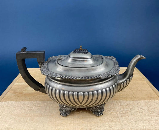Vintage pewter teapot with ornate fluted body, lid finial, and claw feet on Tampa Home & Garden Store