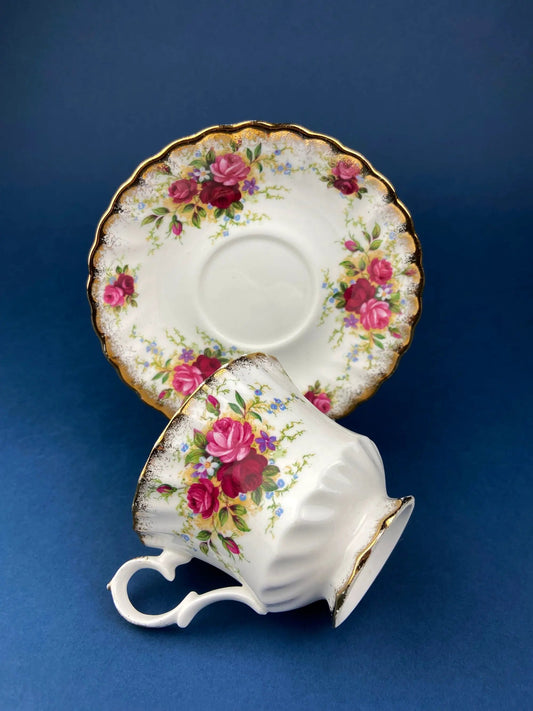 Vintage Queen Anne bone china tea cup and saucer set with rose bouquet and gold trim on Tampa Home & Garden Store