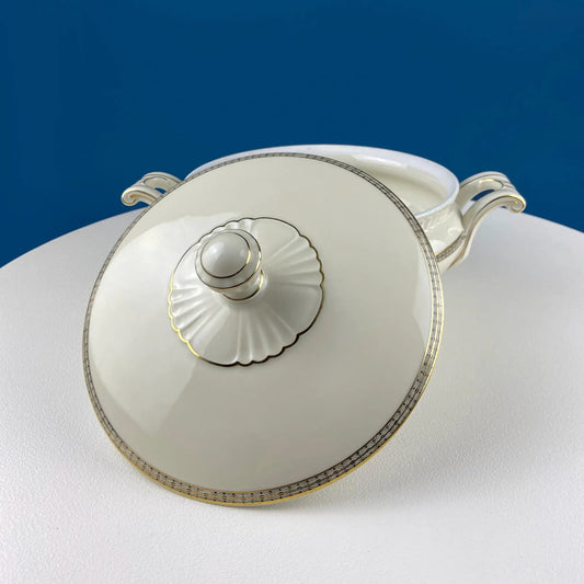 Vintage round porcelain tureen with gold motif and ornate scroll handles on Tampa Home & Garden Store