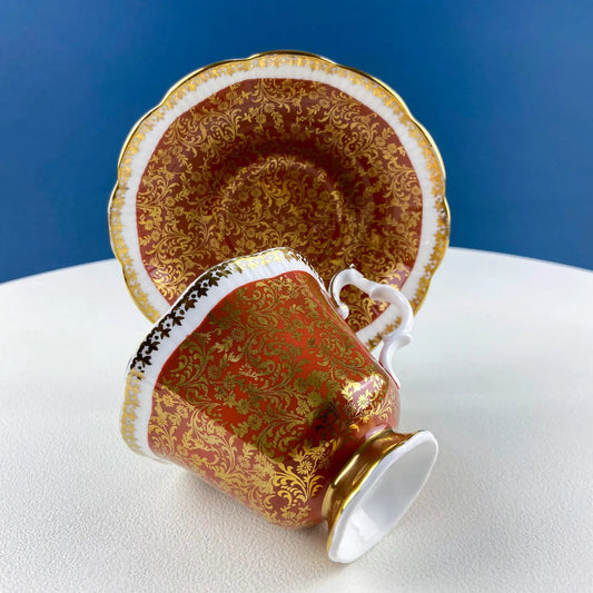 Teacups and saucers set Royal Albert Buckingham with red and gold ornate pattern, stacked on Tampa Home & Garden Store