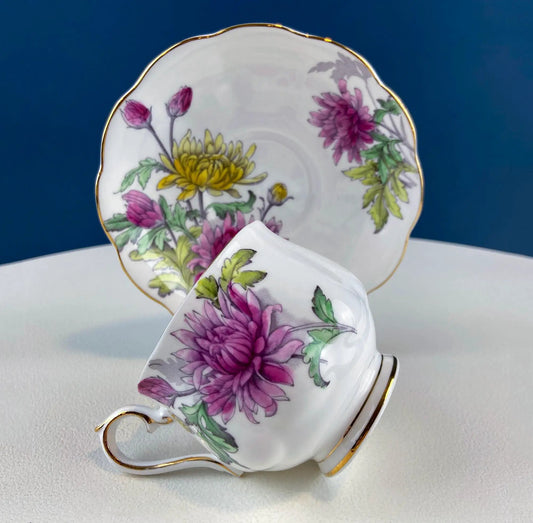 Vintage floral porcelain teacup and saucer with gold rim and chrysanthemum pattern on Tampa Home & Garden Store
