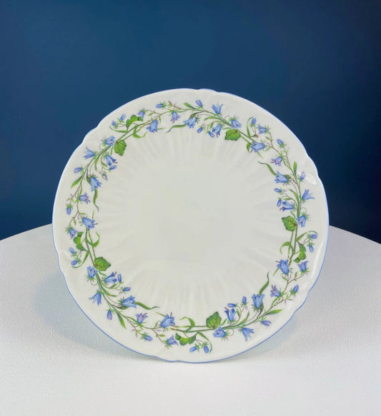 Vintage Shelley footed cake stand in white porcelain with bluebell motif border on Tampa Home & Garden Store