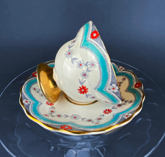 Vintage teacup and saucer set in Royal Dover bone china with turquoise border and red flowers on Tampa Home & Garden Store