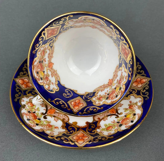 Teacup and saucer set cobalt blue bone china with gold filigree and floral border on Tampa Home & Garden Store