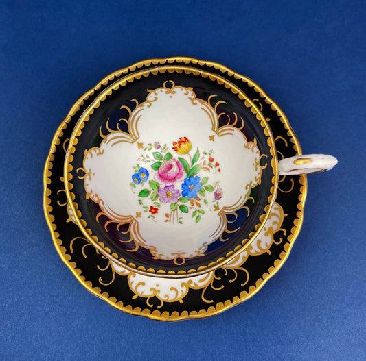Tuscan floral bone china teacup and saucer set with black outer and gold trim on Tampa Home & Garden Store